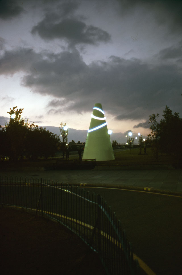 Liliane Lijn. White Koan, 1971. Work for Armada Way, Plymouth. Painted mild steel, neon tube, electric motor, height: 6.1 metres, base diameter: 3.6 metres. Arnolfini Archive at Bristol Record Office. Photographer unknown. © Liliane Lijn. All Rights Reserved, DACS 2016.